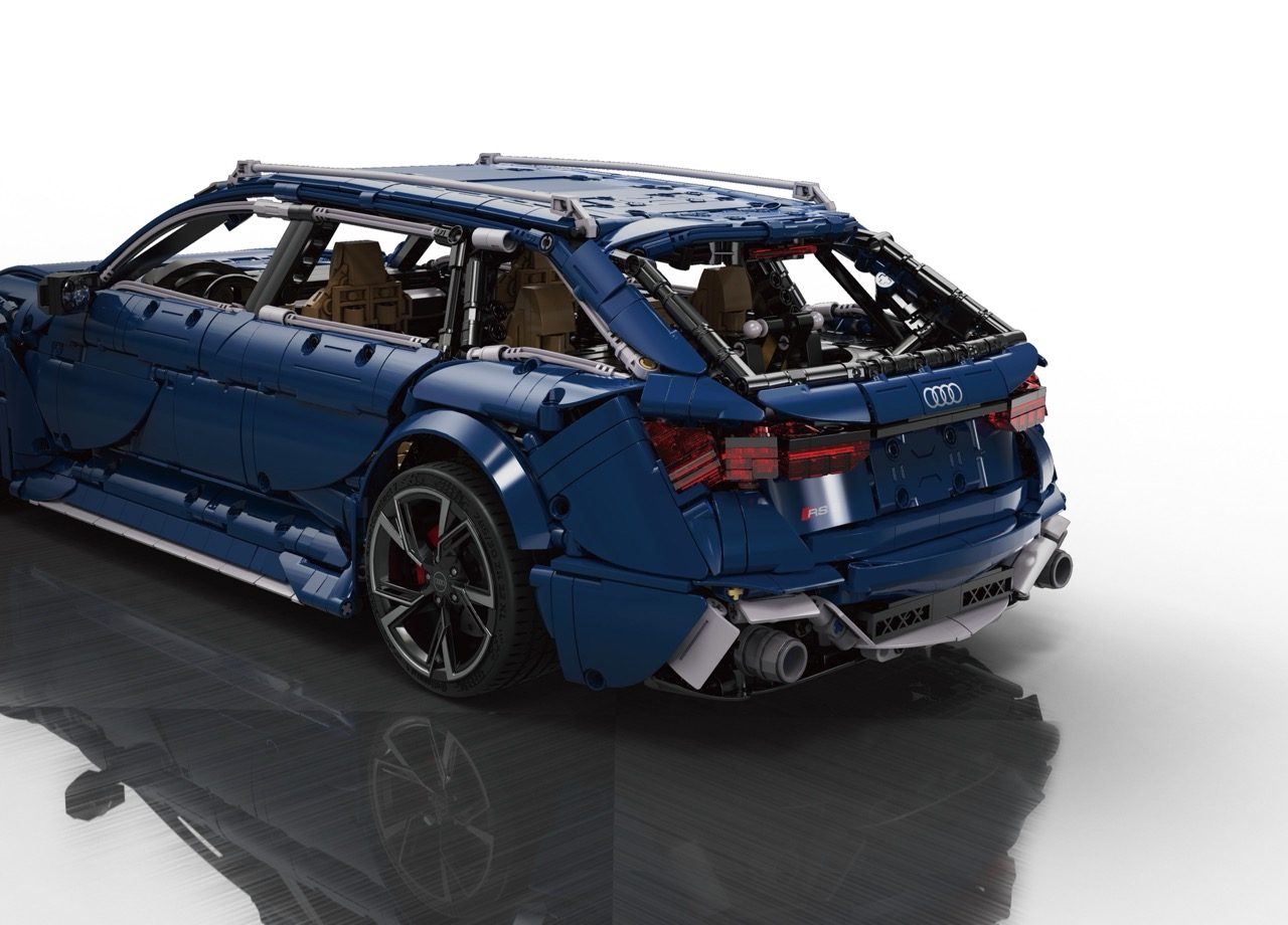 Blue LEGO Audi RS6 wagon with open doors, tan interior, and detailed exterior features displayed against white background.