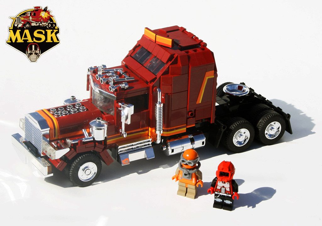 LEGO M.A.S.K. red and black truck with two minifigures and orange helmet accessory.