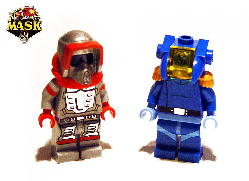 Two M.A.S.K. LEGO minifigures: red and tan suited figure on left, blue suited figure on right with yellow visor.
