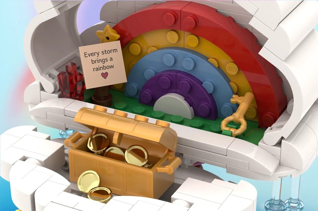 LEGO cloud build opening to reveal colorful rainbow arcs inside with inspirational note and treasure chest.