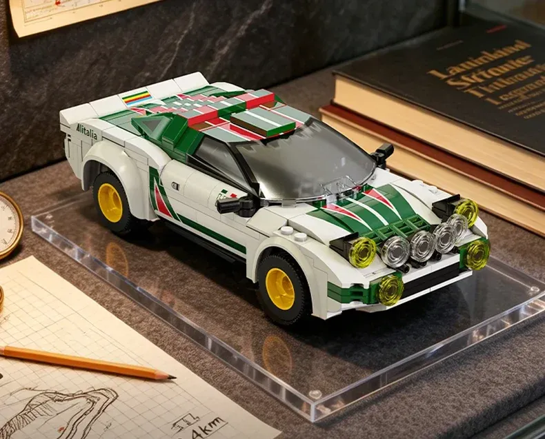 LEGO Lancia Stratos HF rally car with white body, green stripes, yellow wheels, and roof-mounted lights on display.