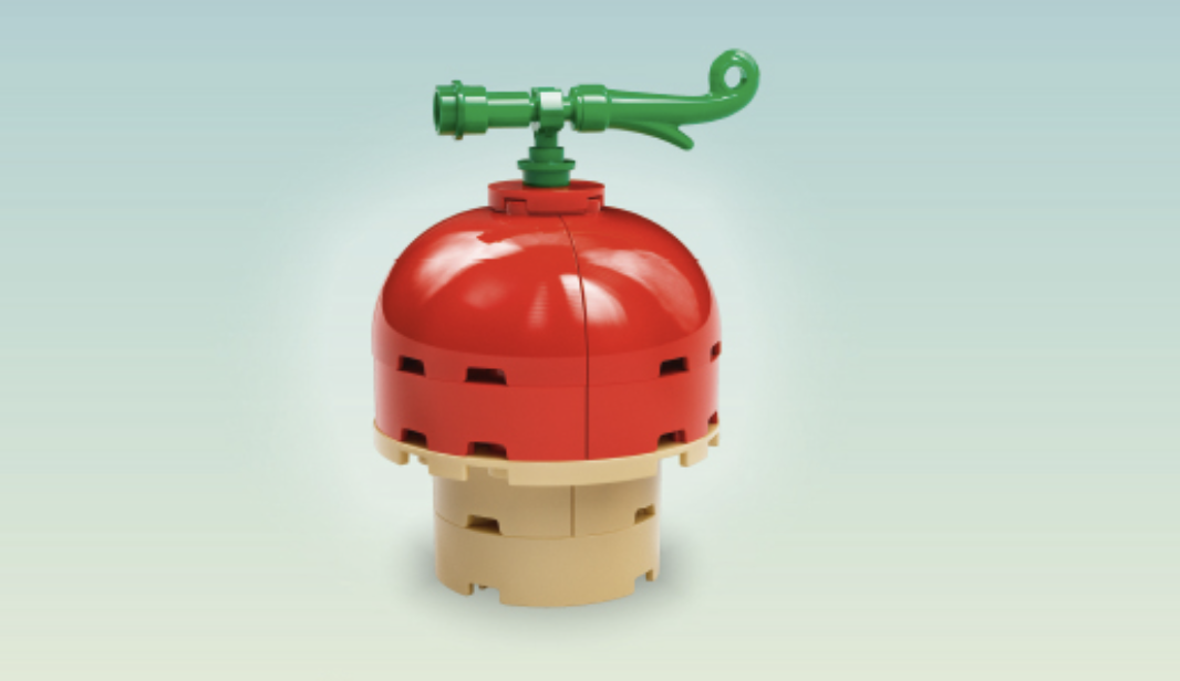 LEGO Human-Human Fruit build with red dome top and tan base, green pipe attachment.