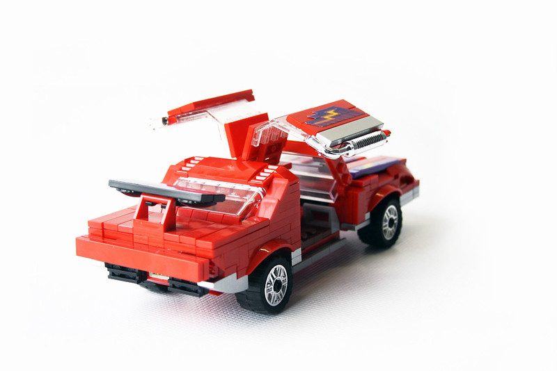 LEGO M.A.S.K. red vehicle with opening hood and detachable components displayed against white background.