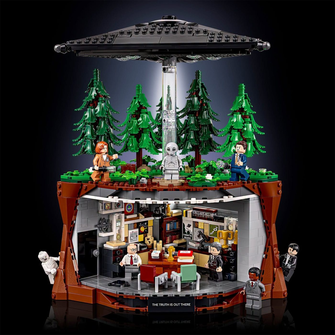 LEGO Ideas The X-Files set 21369 featuring UFO, forest scene, office interior, and minifigures including Mulder and Scully.