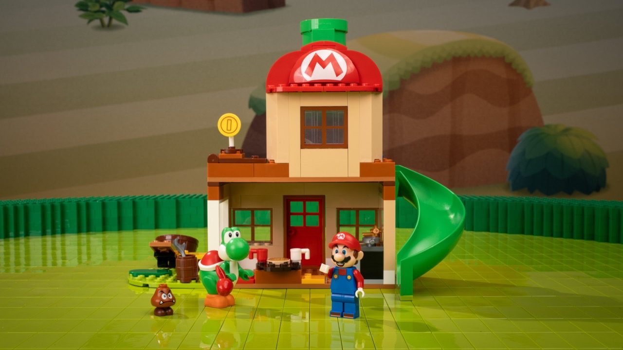 LEGO Super Mario set featuring Mario minifigure, Yoshi, and a mushroom house with red roof and green slide.