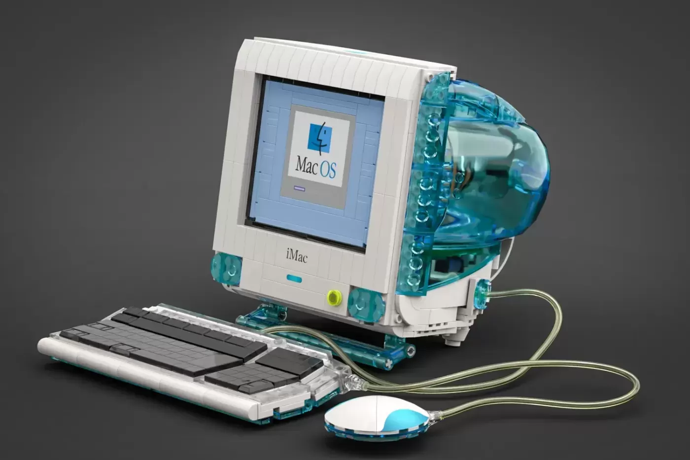 LEGO iMac G3 set with transparent turquoise case, keyboard, and mouse displayed against gray background.