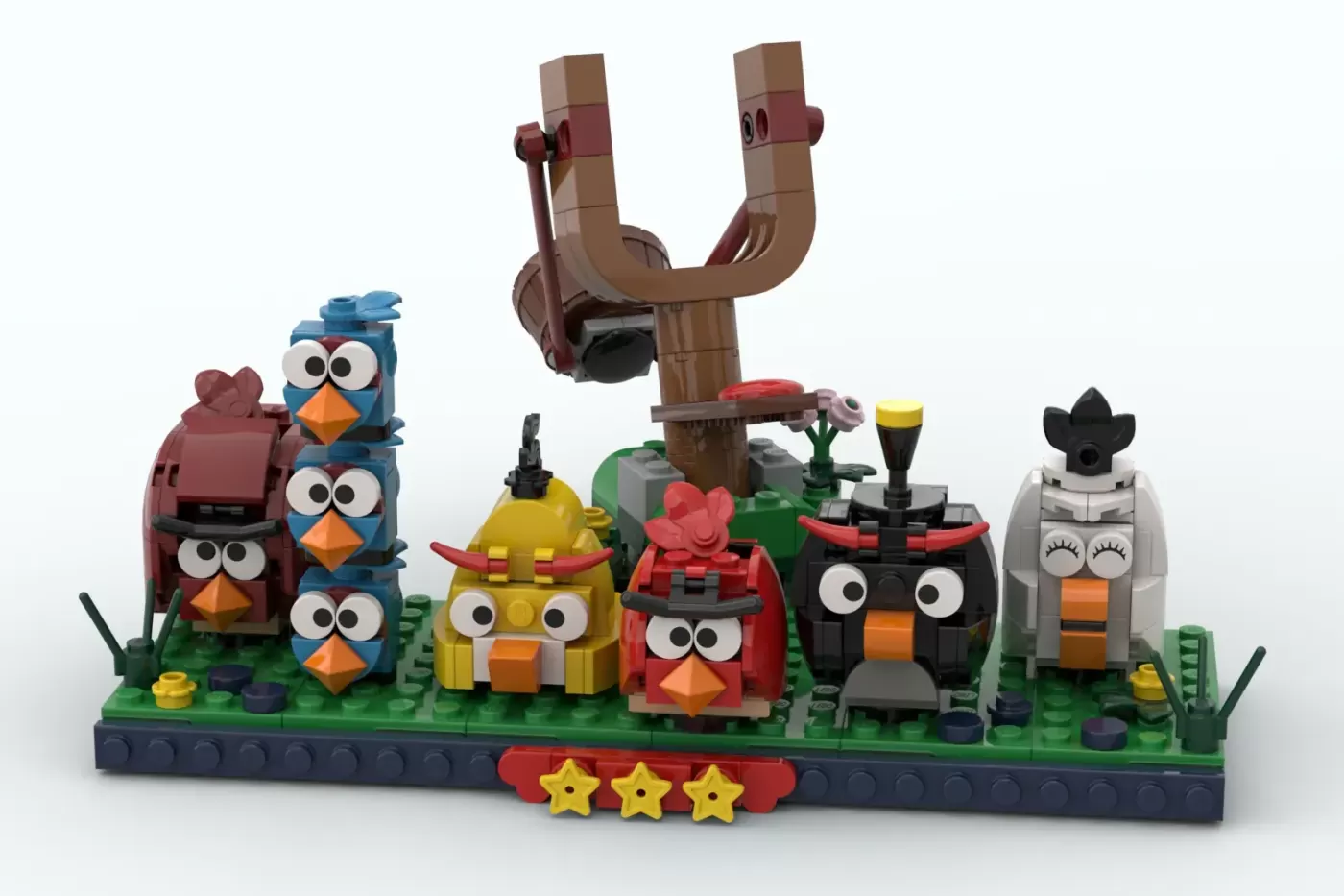 LEGO Angry Birds set featuring brick-built birds, wooden slingshot, and green baseplate with three stars.