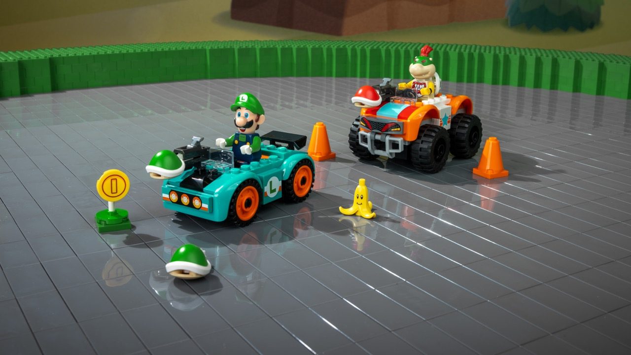 LEGO Super Mario race track set with Luigi minifigure in turquoise kart, Bowser in orange ATV, banana peel, coins, and cones.