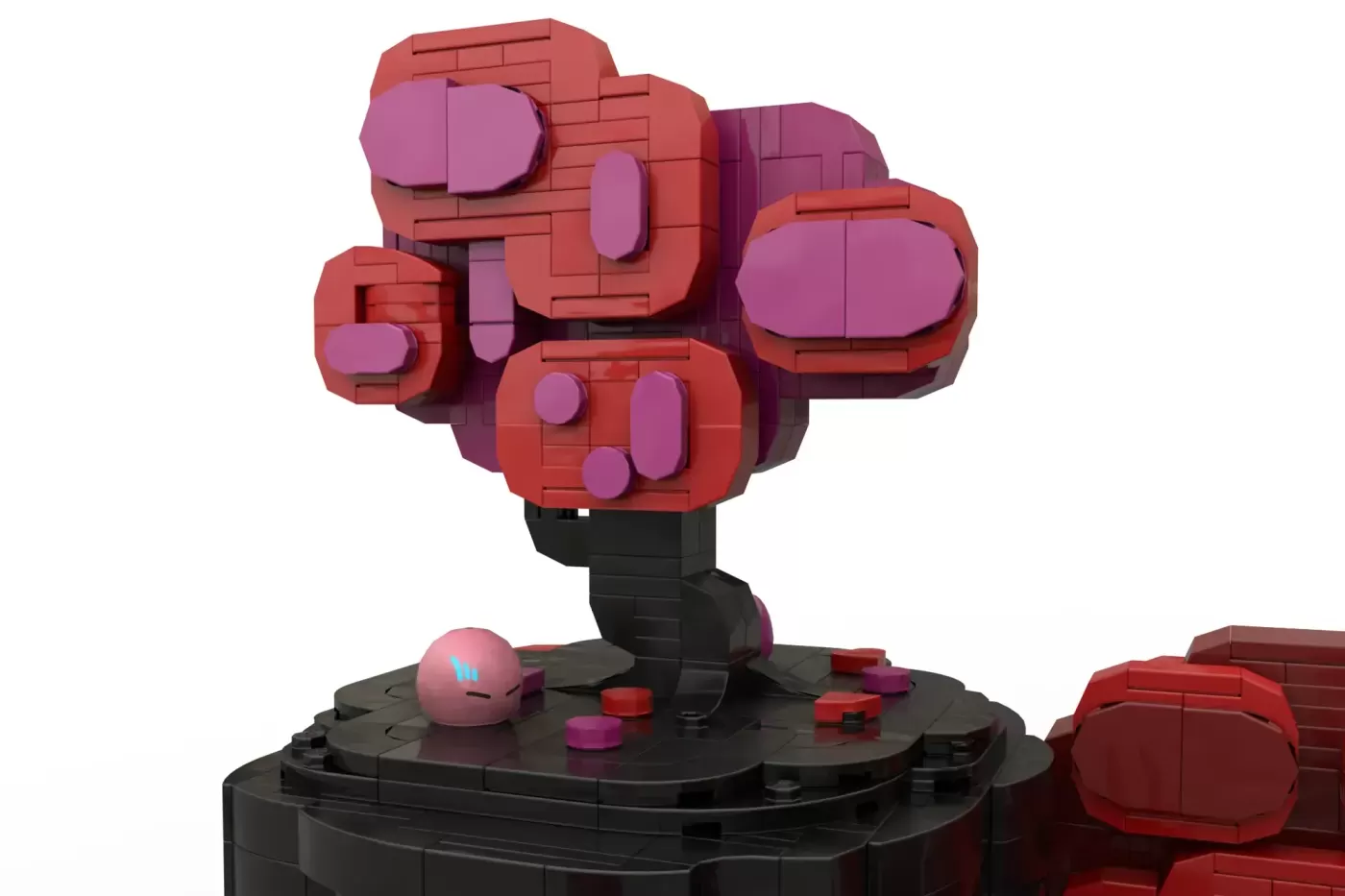 LEGO brick sculpture of red and pink blocky character with rounded features on black base plate.