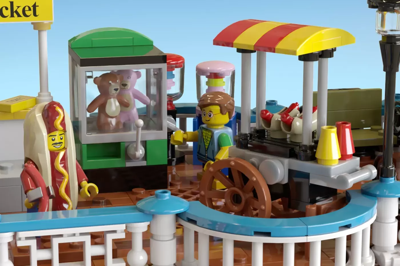 LEGO seaside pier scene with minifigures at game booths, ice cream stand, and vintage-style attractions with colorful awni…