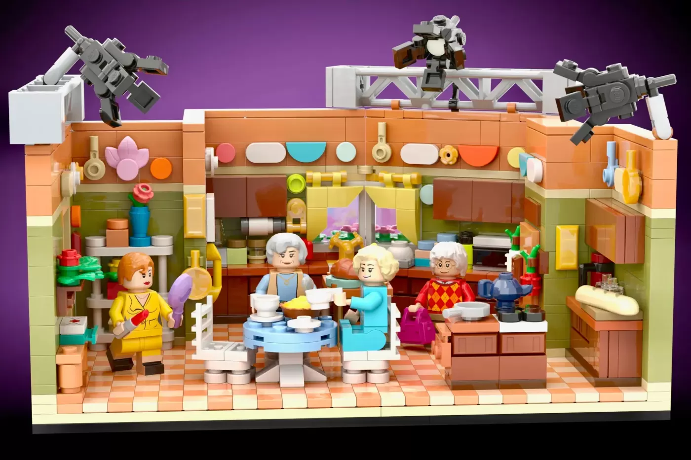 LEGO Golden Girls kitchen set with four elderly female minifigures, detailed furniture, appliances, and camera equipment o…