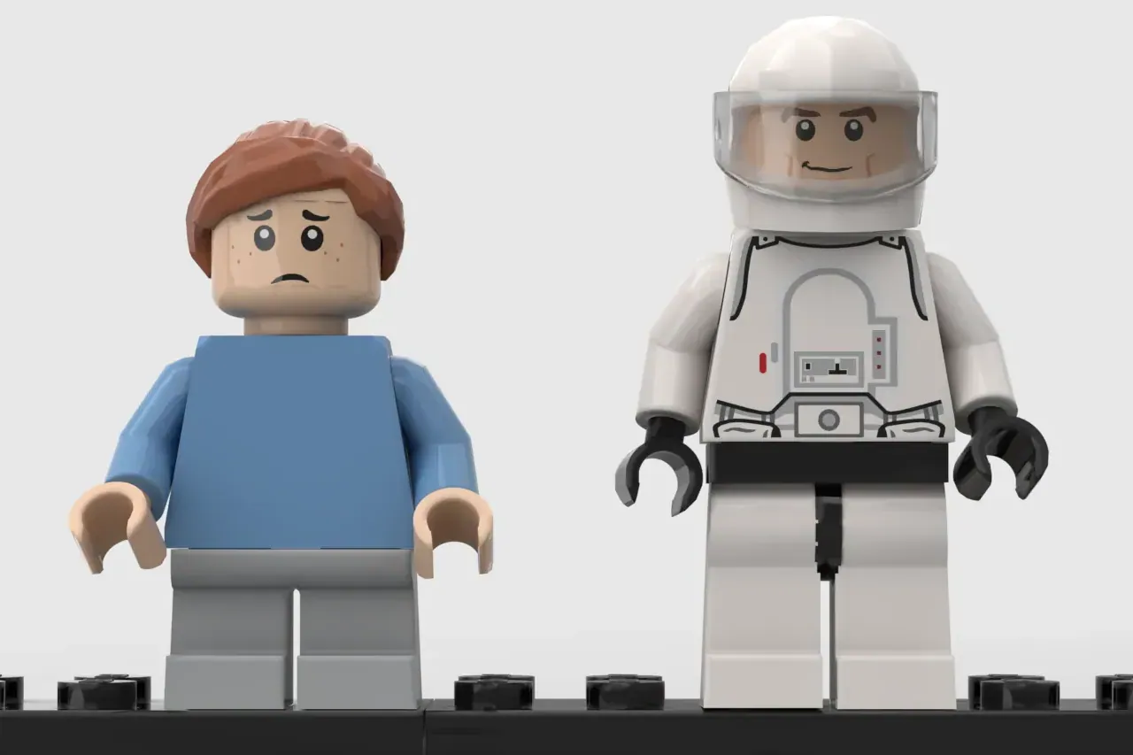 Two LEGO minifigures on a black baseplate: a sad character in blue shirt and a smiling astronaut in white spacesuit with h…