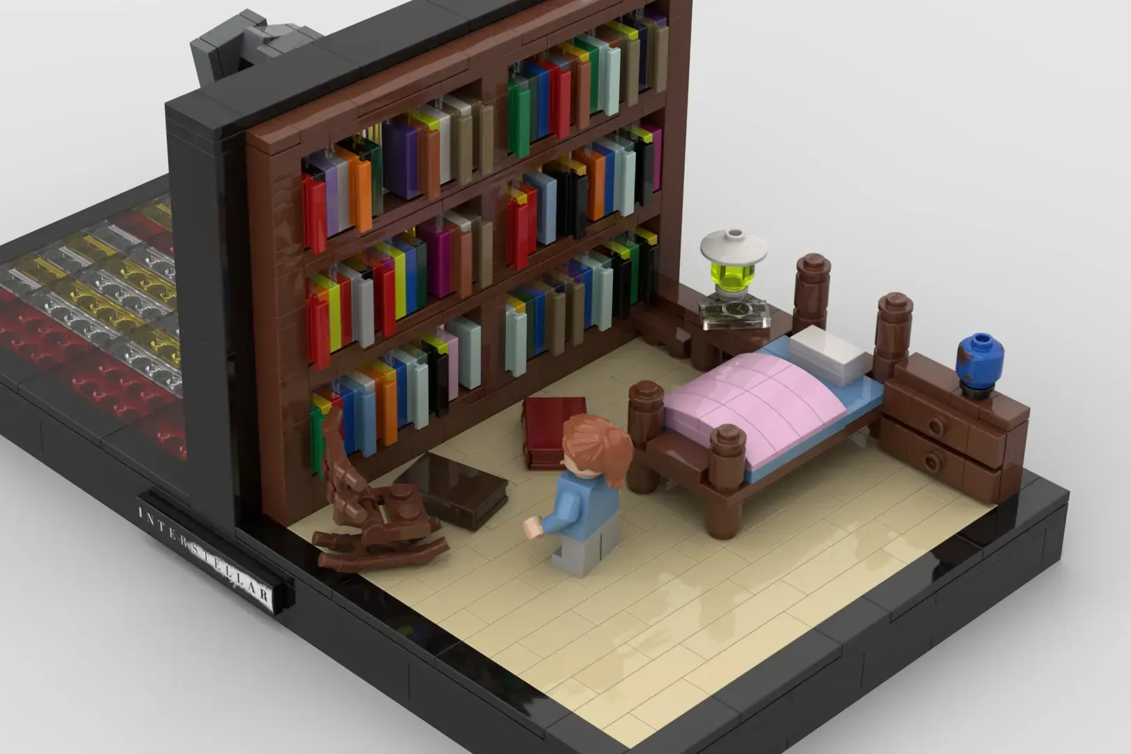 LEGO diorama of a bedroom with bookshelves, bed, and minifigures from Interstellar movie scene.