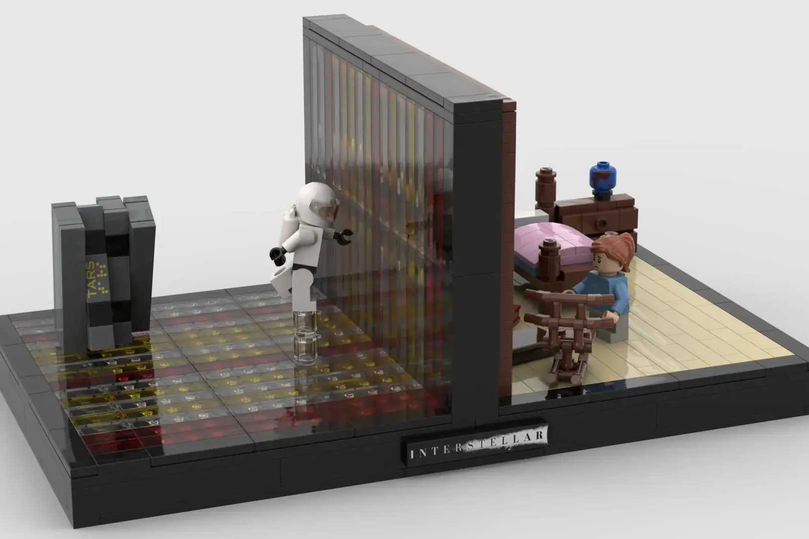 LEGO Interstellar bookend featuring Cooper minifigure, Murph character, TARS robot, bedroom scene with bed, and starfield …