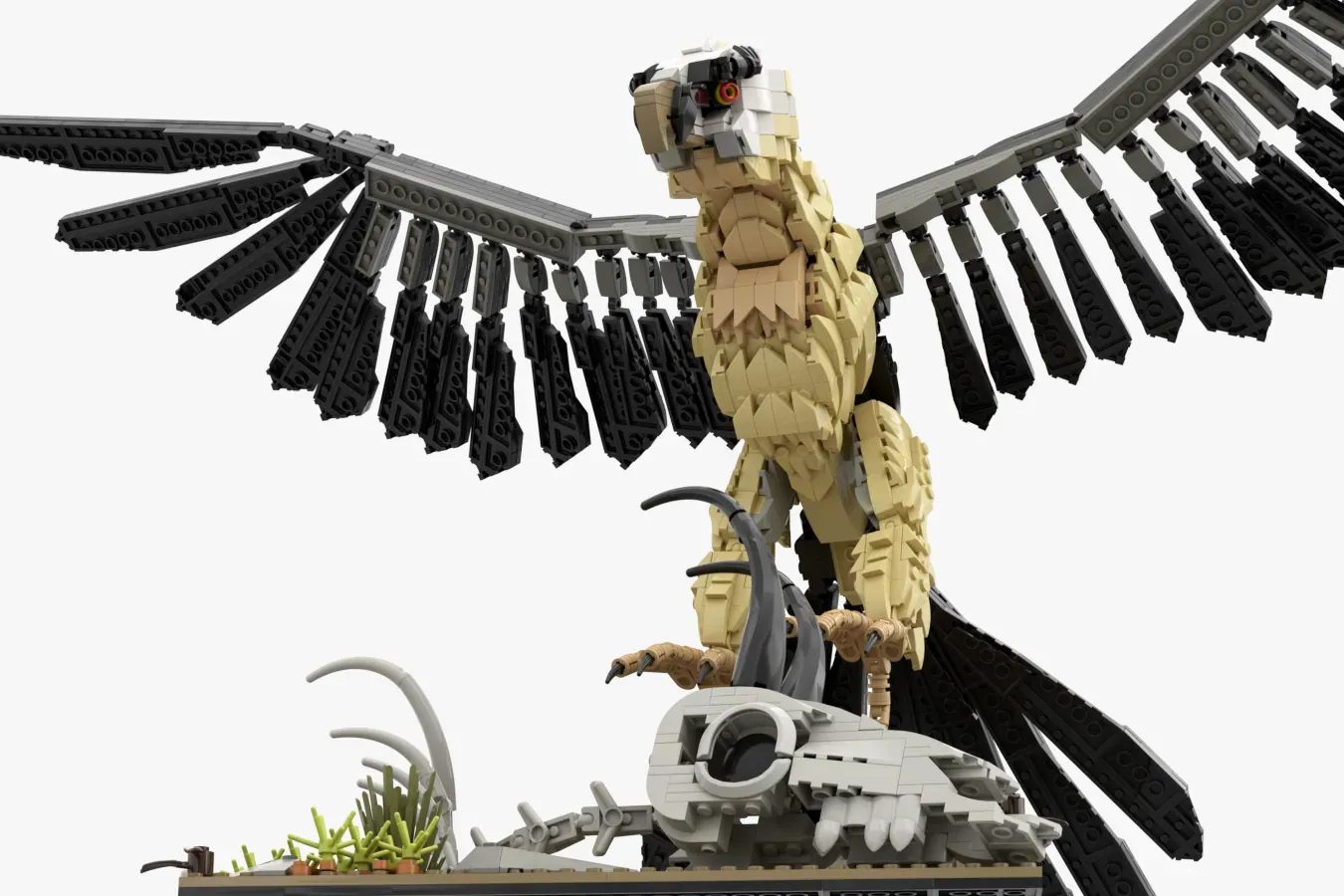 LEGO Bearded Vulture set with tan and black bird featuring articulated wings, perched on rocky base with vegetation.