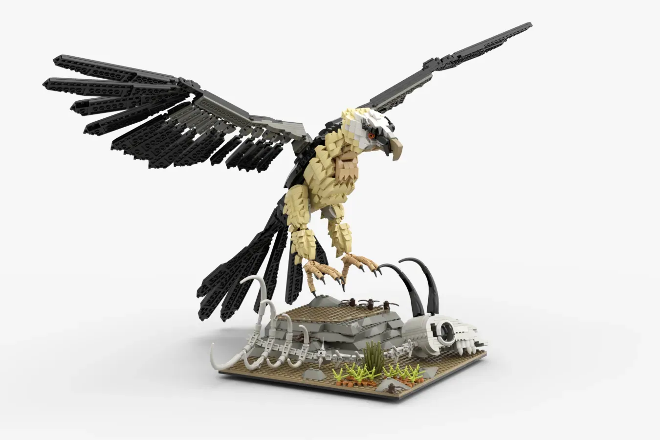 LEGO bearded vulture with articulated black and tan wings, mounted on base with white robotic elements and grass.