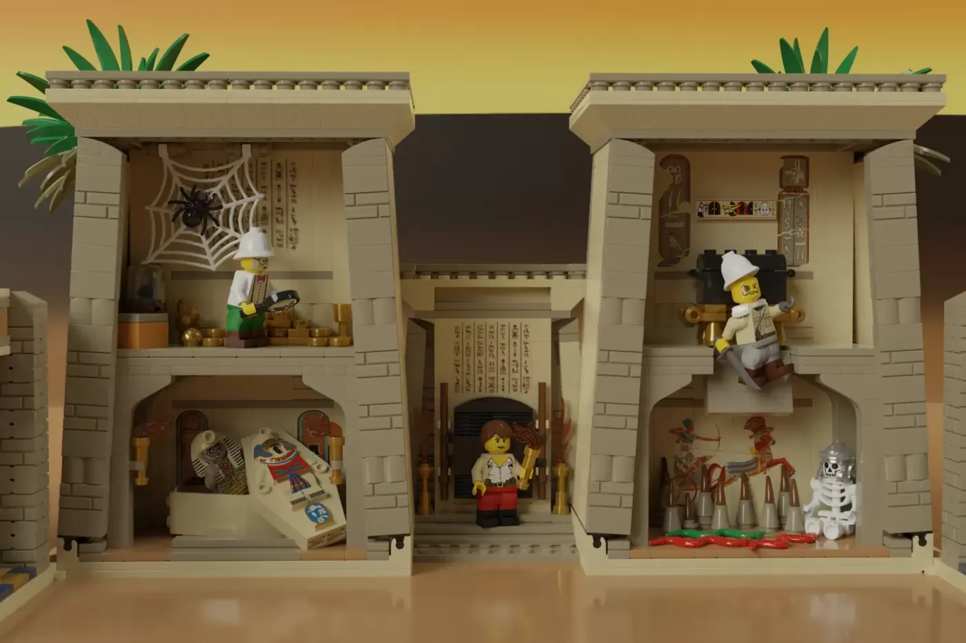 LEGO Adventurers Egyptian temple set opened to show interior rooms with minifigures, hieroglyphics, and decorative elements.