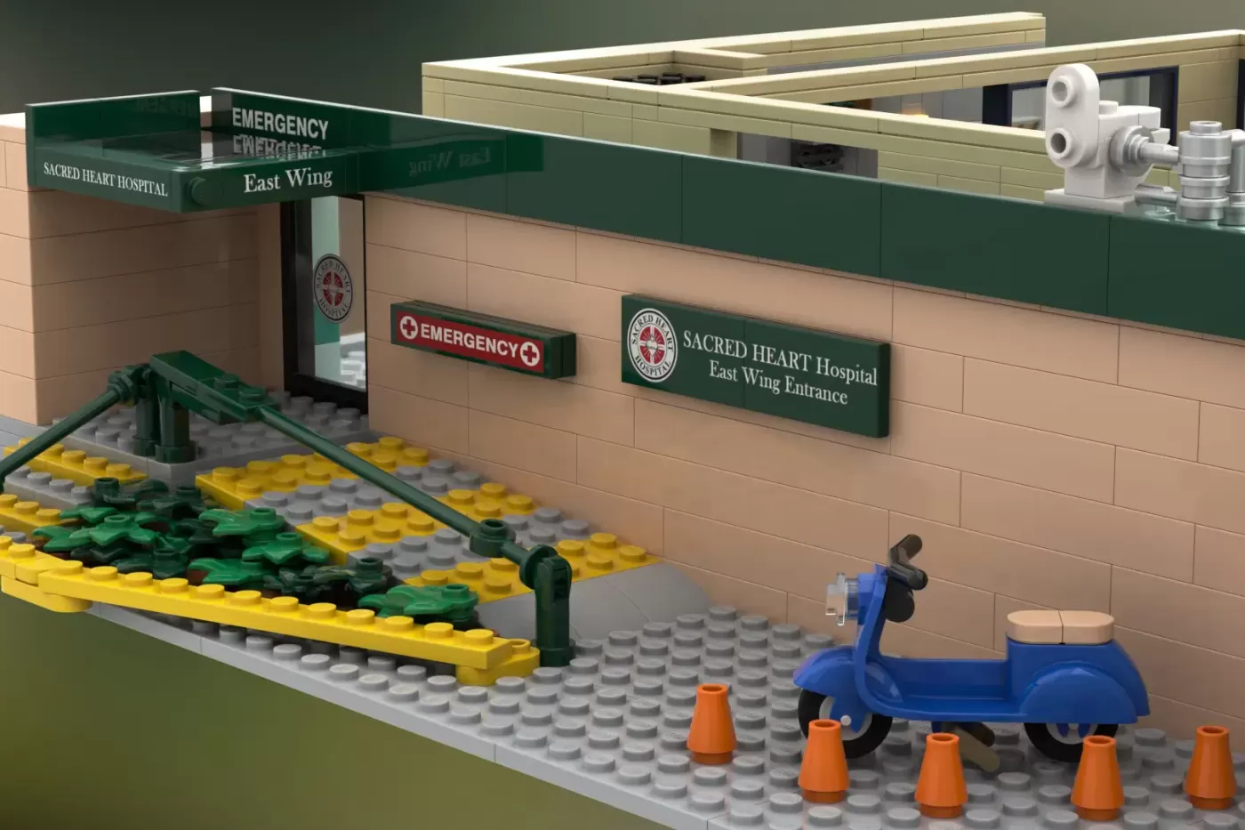LEGO Sacred Heart Hospital East Wing emergency entrance with blue scooter and orange traffic cones.
