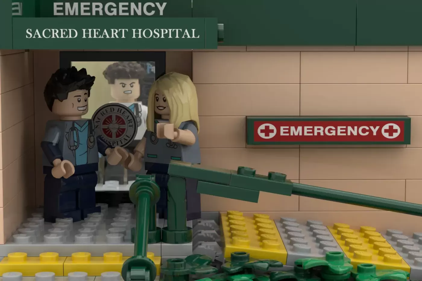 LEGO Sacred Heart Hospital Emergency entrance with three minifigures in medical scrubs and hospital signage.