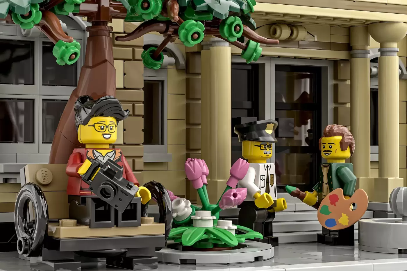 LEGO minifigures in an art gallery with decorative green flowers, pink plants, and a painter's palette prop among classica…