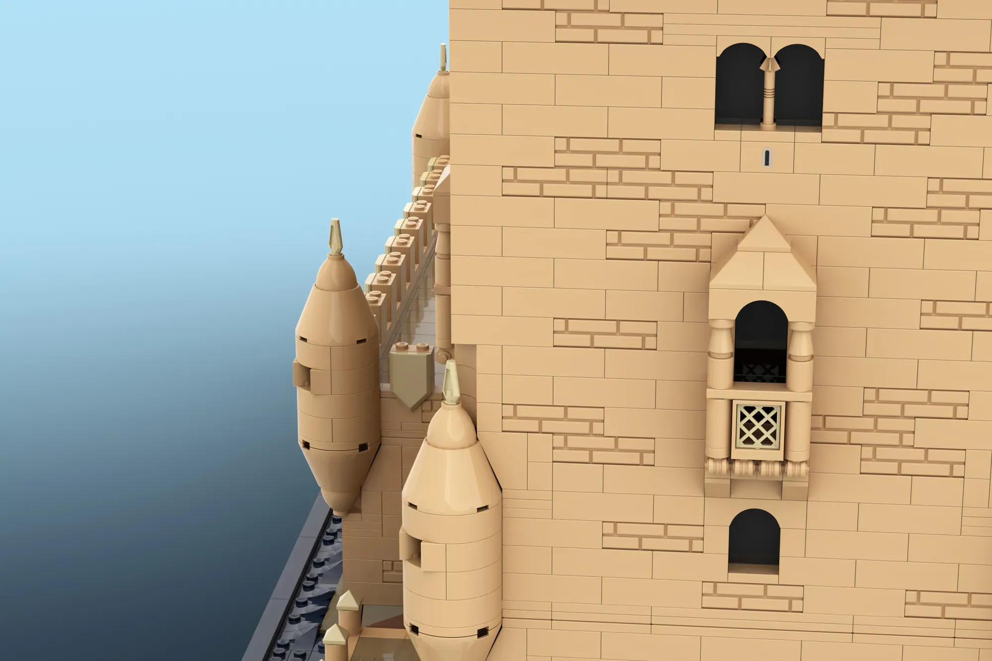 LEGO Belém Tower model showing cylindrical turrets with cone roofs, arched windows, and detailed brick stonework against b…