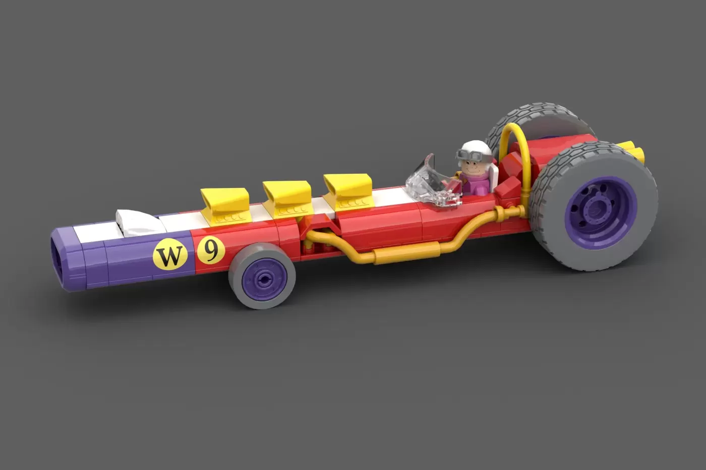 LEGO Wacky Races car W9 with red, yellow, and purple sections, large wheels, and minifigure driver.